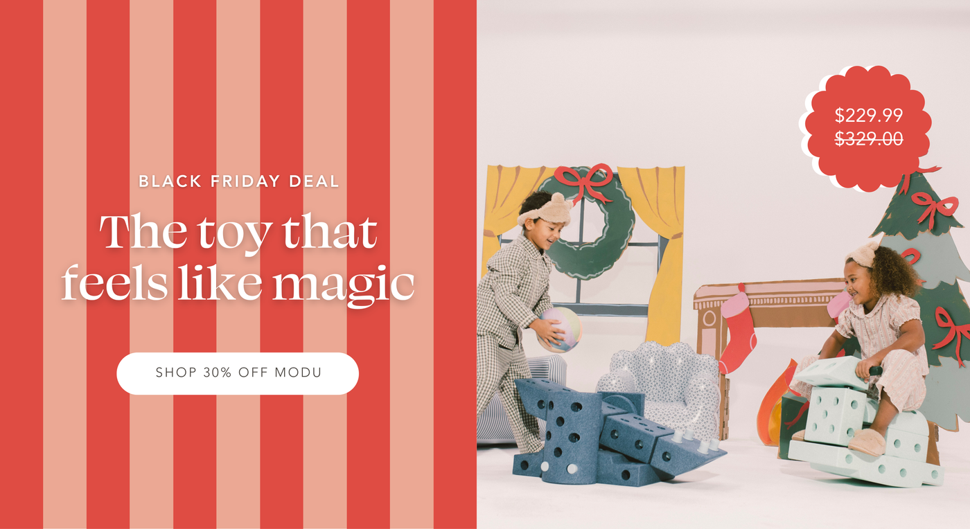 Two kids in pajamas playing with MODU Dreamer Set. One putting a ball on a toy catapult and the other rocking on a rocking horse. Black Friday Deal | The toy that feels like magic | Shop 30% Off Modu