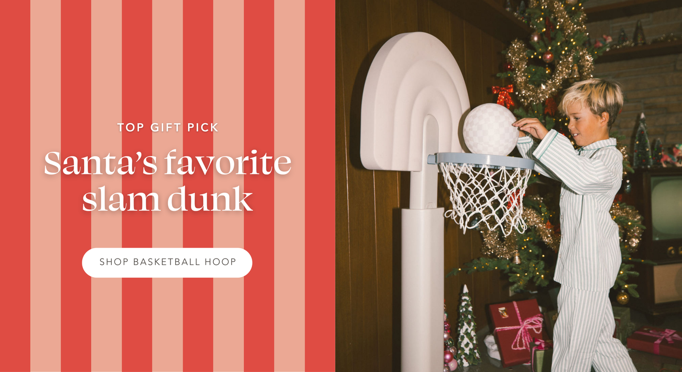 Kid slam dunking basketball into basketball hoop next to tree. Top Gift Pick: Santa's favorite slam dunk | Shop Hoop